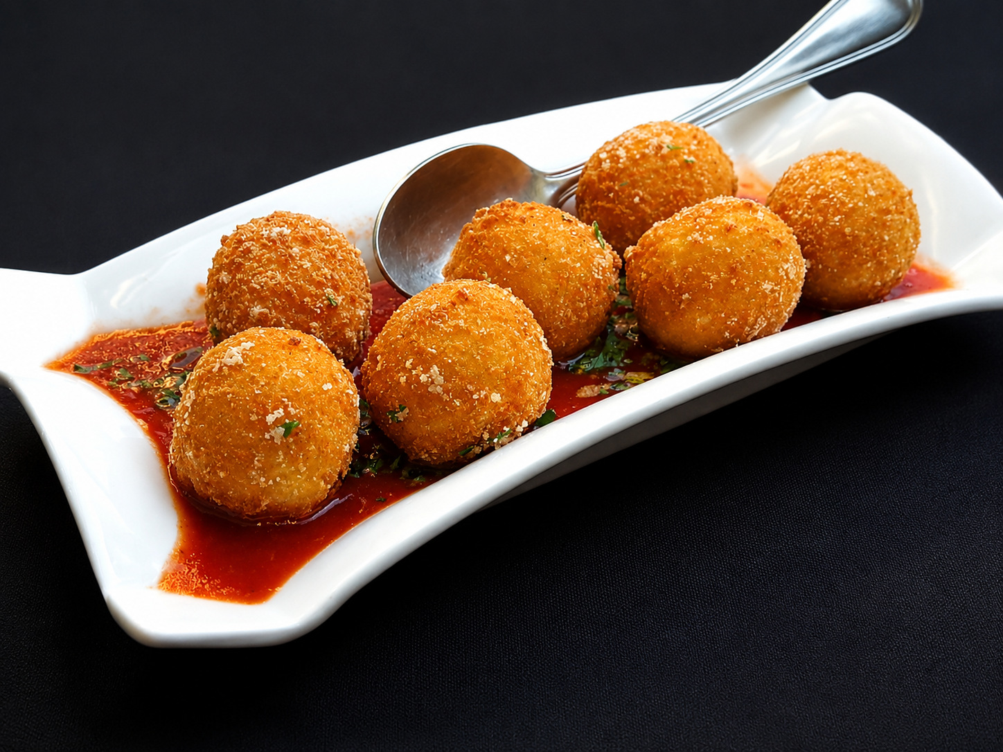 Sicilian arancini with tomato sauce