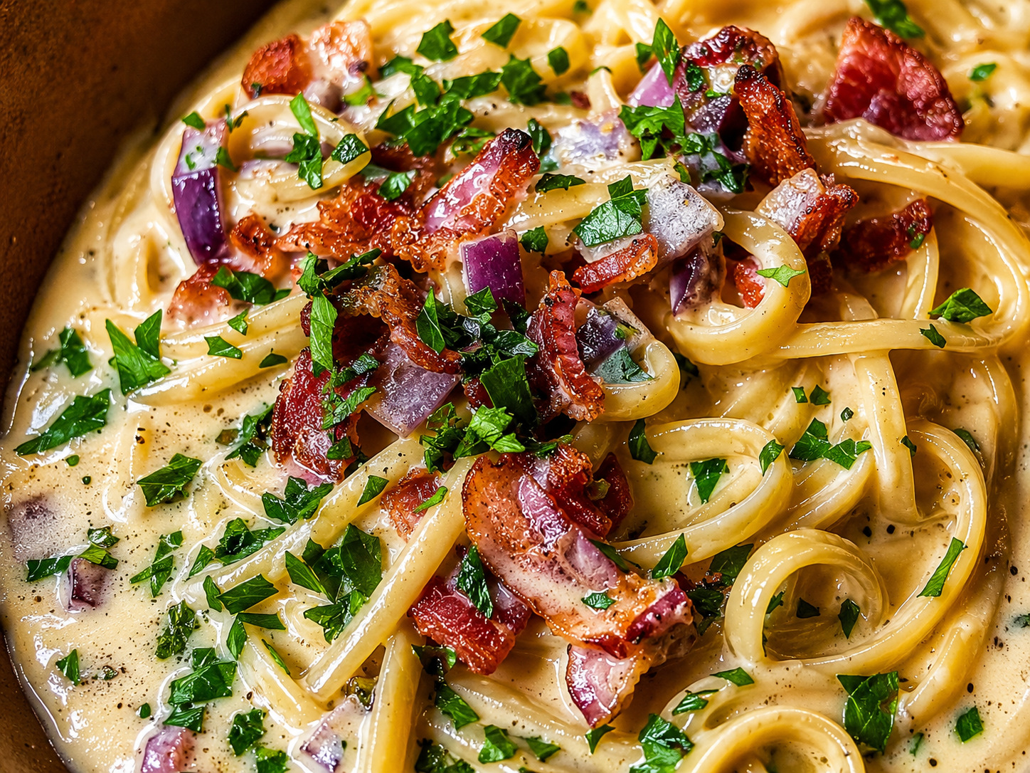 Linguine carbonara with bacon and herbs