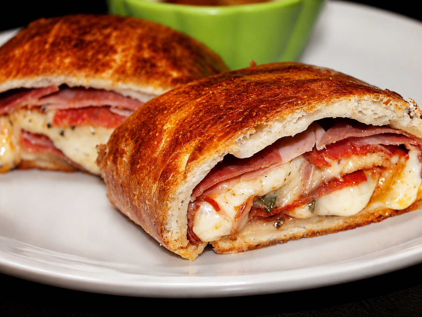 Sliced stromboli filled with Italian meats and mozzarella